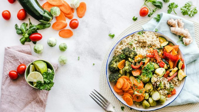 Colorful quinoa salad with fresh vegetables creates a healthy, balanced meal.