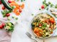 Colorful quinoa salad with fresh vegetables creates a healthy, balanced meal.