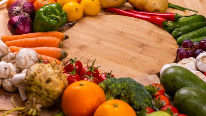 orange and green vegetables on brown wooden table