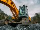 yellow and green excavator on rocky ground during daytime